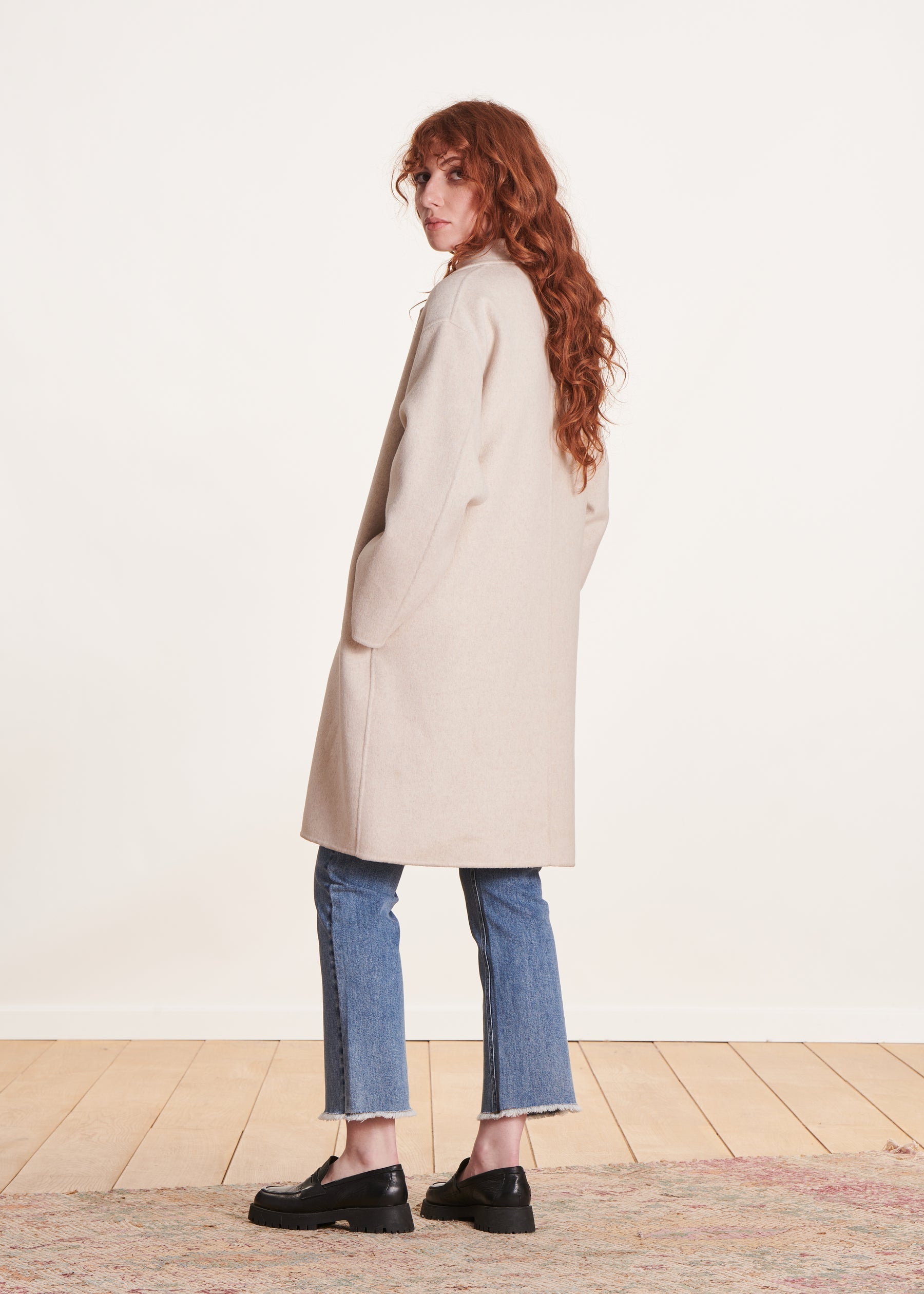 Manteau mi-long écru en lainage