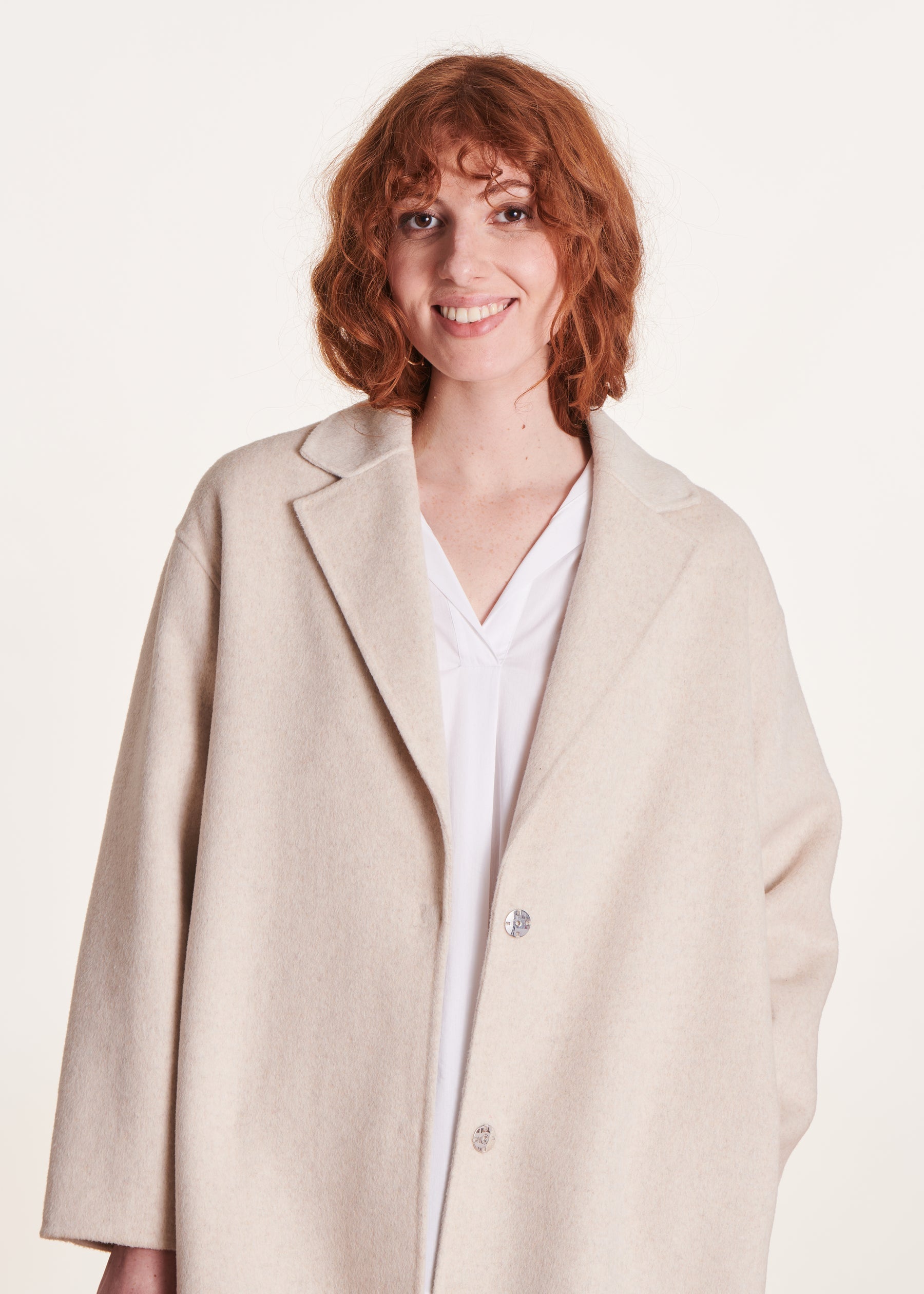 Manteau mi-long écru en lainage
